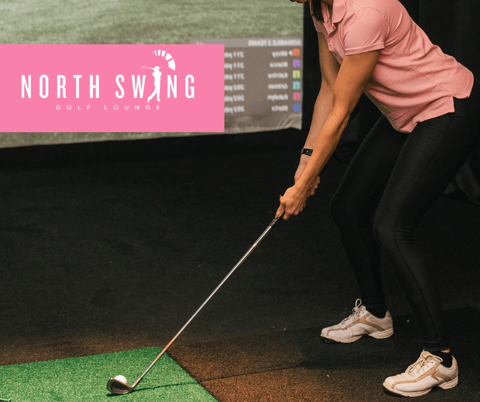 A golfer tees off at North Swing Golf Lounge